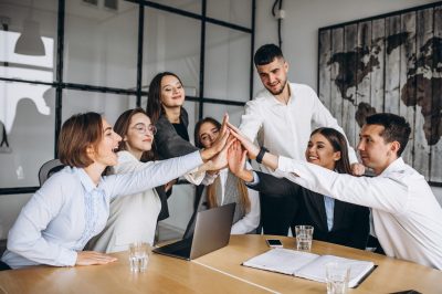 Group of people working out business plan in an office Group of people working out business plan in an office